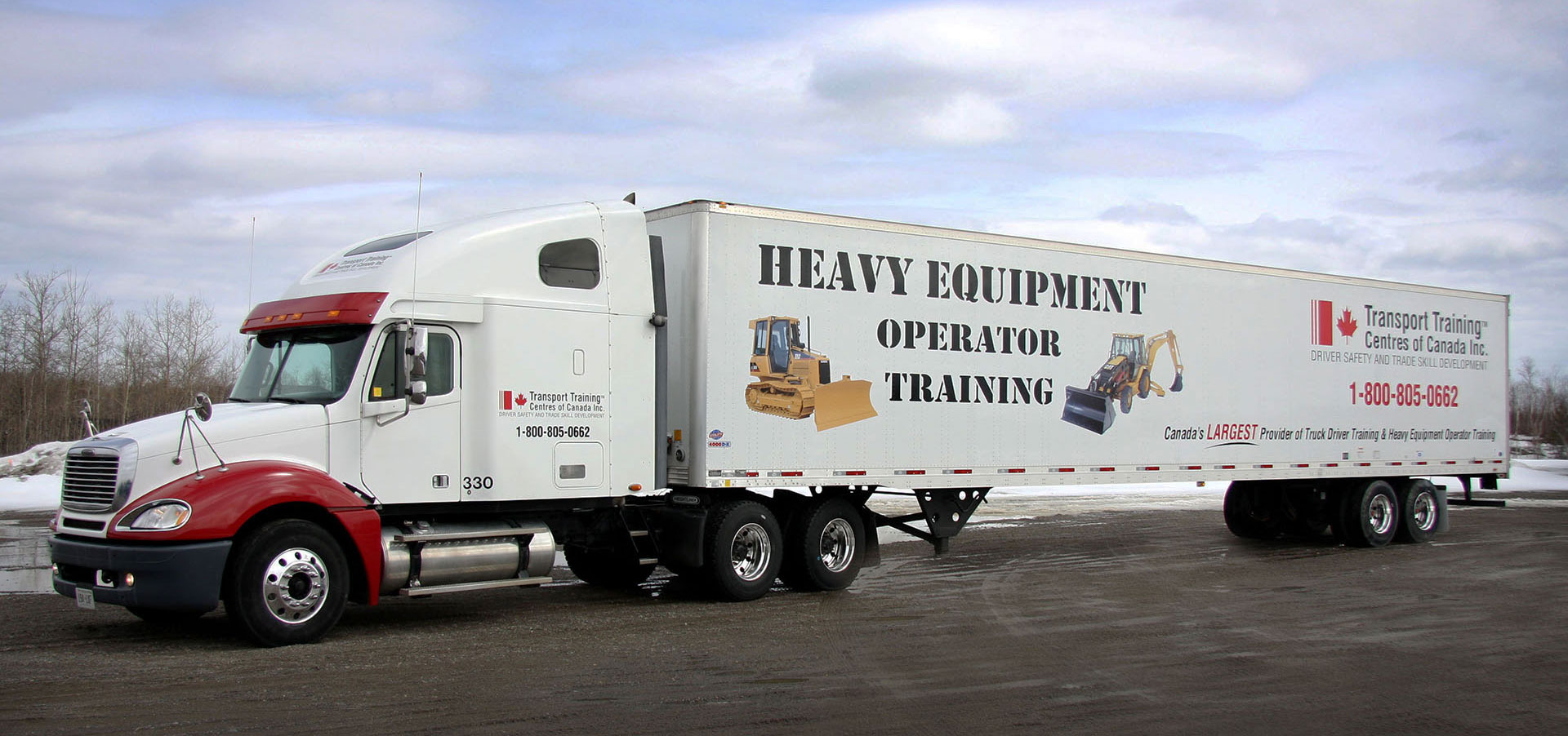 Photo of a truck with the TTCC logo on the side and the words Heavy Equipment Operator Training in Fredericton, NB